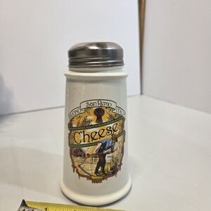 mark. White Ceramic Cheese Shaker with Yellow & Green Vintage Graphic